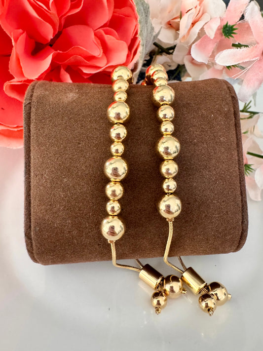 Pulsera ajustable con cuentas doradas 8mm – Bañada en oro de 18K