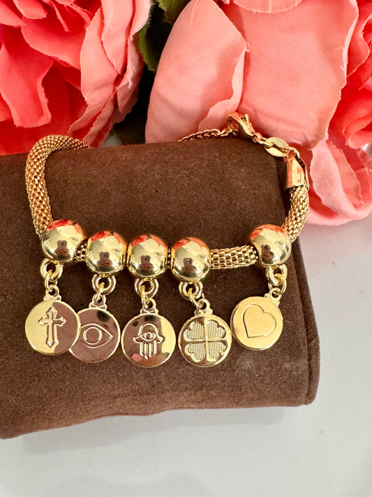 Pulsera con dijes de corazón, cruz, ojo turco y mano de Fátima – Bañada en oro de 18K