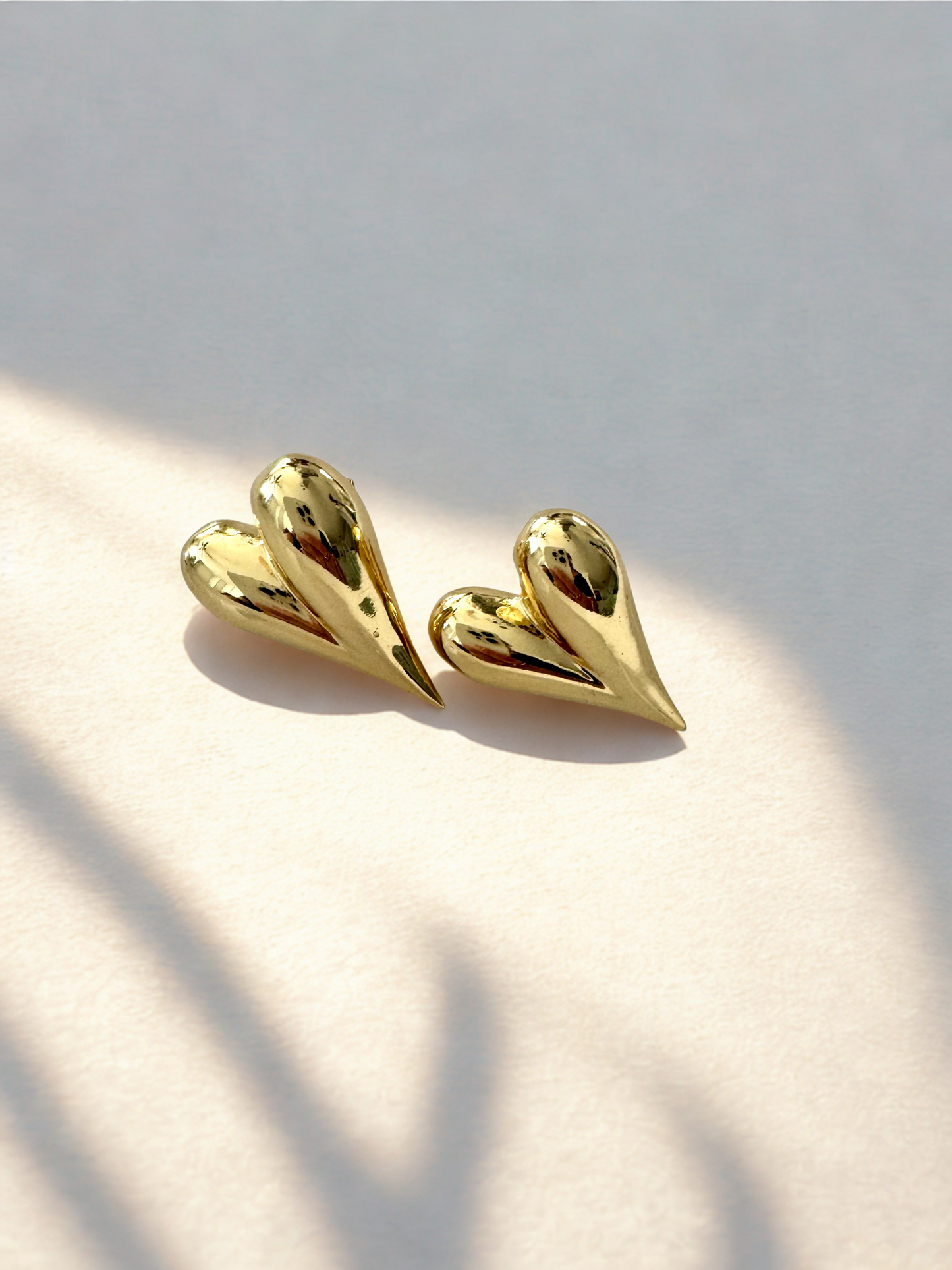 Aretes corazón doble